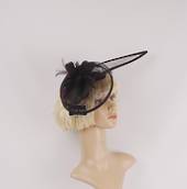 Hatinator in sinamay and feathers w curved extended base, band,  black with a touch of purple. Style: HS/3004/PPLE
